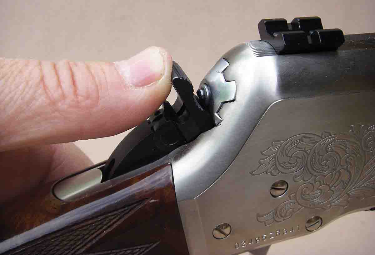 When the hammer is in the half-cock position it can be pushed forward, or “folded,” which results in the hammer resting on the bolt rather than the firing pin.